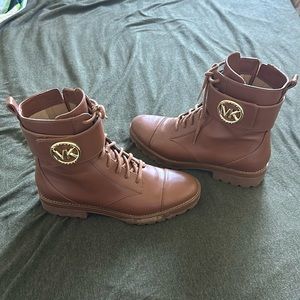 Michael Kors brown zip-up MK buckle boots.